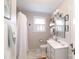 Bright bathroom featuring a shower with curtain, white vanity, and marble-look tile flooring at 968 Waverly Ave, Rock Hill, SC 29730