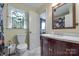 Bathroom featuring decorative window, dark vanity, and floral shower curtain at 968 Waverly Ave, Rock Hill, SC 29730