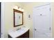 Bathroom featuring a modern sink with wood accents, a mirror, and a white door at 968 Waverly Ave, Rock Hill, SC 29730