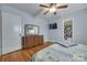Bright bedroom featuring hardwood floors, vintage dresser, and en suite bathroom at 968 Waverly Ave, Rock Hill, SC 29730