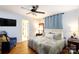 Comfortable bedroom with a ceiling fan, hardwood floors, and a calming blue color scheme at 968 Waverly Ave, Rock Hill, SC 29730