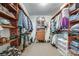 Walk-in closet with custom shelving, multiple hanging rods, and carpet flooring at 968 Waverly Ave, Rock Hill, SC 29730