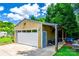 Detached garage with covered outdoor kitchen, and a well-manicured lawn at 968 Waverly Ave, Rock Hill, SC 29730