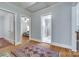Hallway with hardwood floors, neutral walls, and doorways leading to bedroom and bath at 968 Waverly Ave, Rock Hill, SC 29730