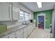 Bright kitchen featuring white cabinets, granite countertops, stainless steel appliances, and tile flooring at 968 Waverly Ave, Rock Hill, SC 29730