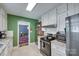 Bright kitchen featuring white cabinets, granite countertops, stainless steel appliances, and tile flooring at 968 Waverly Ave, Rock Hill, SC 29730