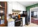 Charming kitchen with white cabinets, granite countertops, and stainless steel appliances at 968 Waverly Ave, Rock Hill, SC 29730