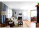 Bright living room with a decorative fireplace, hardwood floors, and stylish curtains at 968 Waverly Ave, Rock Hill, SC 29730