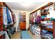 Spacious walk-in closet with custom shelves and a central seating area for storage at 968 Waverly Ave, Rock Hill, SC 29730