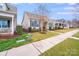 Well-maintained neighborhood street view showcases charming homes with green lawns, landscaping, and inviting walkways at 11135 Bailey Park Nature Dr, Cornelius, NC 28031