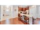 The kitchen features granite countertops and stainless appliances with seating at the breakfast bar at 11135 Bailey Park Nature Dr, Cornelius, NC 28031