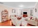 Cozy living room featuring hardwood floors, comfortable seating, and plenty of natural light at 11135 Bailey Park Nature Dr, Cornelius, NC 28031