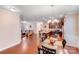 Open floorplan view with dining area, kitchen, and living room all seamlessly connected for gatherings at 11135 Bailey Park Nature Dr, Cornelius, NC 28031