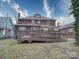 Exterior view of the home showcasing the deck, yard and brick facade at 113 2Nd St, Spencer, NC 28159