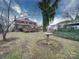 Expansive backyard with mature trees and an outdoor stone bird bath feature at 113 2Nd St, Spencer, NC 28159