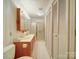 Bathroom featuring a vanity, shower, and ample storage, combining style and function at 113 2Nd St, Spencer, NC 28159