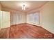 Bright bedroom with hardwood floors and natural light, perfect for relaxation at 113 2Nd St, Spencer, NC 28159