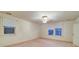 Cozy bedroom with carpeted floors, natural light from large windows, and neutral paint at 113 2Nd St, Spencer, NC 28159
