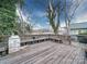 Large wooden deck with built-in benches offering space for seating at 113 2Nd St, Spencer, NC 28159
