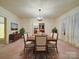 Elegant dining room with a large table, seating for six, and classic decor for memorable gatherings at 113 2Nd St, Spencer, NC 28159