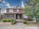 Charming two-story brick home featuring a screened front porch and mature landscaping at 113 2Nd St, Spencer, NC 28159
