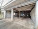 Open garage offering ample space for parking and storage at 113 2Nd St, Spencer, NC 28159