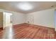 Spacious living room featuring hardwood floors, white trim, and ample natural light at 113 2Nd St, Spencer, NC 28159