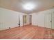 Living room featuring hardwood floors, white trim, and ample natural light at 113 2Nd St, Spencer, NC 28159