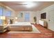 Bright main bedroom features a luxurious bed, stylish furniture, and ample space for restful nights at 113 2Nd St, Spencer, NC 28159