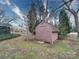 Exterior view of a wooden storage shed in backyard at 113 2Nd St, Spencer, NC 28159