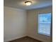 Cozy bedroom with carpet, window and base molding at 133 Plank Barn Ln, Stony Point, NC 28678