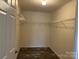 Walk-in closet featuring wood-style floors and wire shelving at 133 Plank Barn Ln, Stony Point, NC 28678