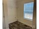 Bright closet space features wood grain flooring, wire shelving, and natural light from the window at 133 Plank Barn Ln, Stony Point, NC 28678