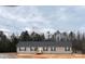 Charming single-story home featuring a cozy front porch and neat landscaping at 133 Plank Barn Ln, Stony Point, NC 28678