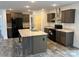 Modern kitchen features stainless steel appliances and a large center island at 133 Plank Barn Ln, Stony Point, NC 28678
