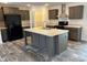 Modern kitchen features stainless steel appliances and a large center island at 133 Plank Barn Ln, Stony Point, NC 28678