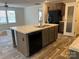 Bright kitchen features stainless steel appliances and a large center island at 133 Plank Barn Ln, Stony Point, NC 28678