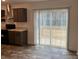 Bright kitchen flows to a sliding glass door leading to a balcony at 133 Plank Barn Ln, Stony Point, NC 28678