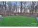 Spacious backyard with lush green lawn and privacy from surrounding trees at 17639 Stuttgart Rd, Davidson, NC 28036