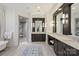 Lavish bathroom boasts dual vanities, soaking tub, walk-in shower with tile surround at 17639 Stuttgart Rd, Davidson, NC 28036