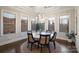 Cozy dining room with large windows, a round table, and comfortable seating for six at 17639 Stuttgart Rd, Davidson, NC 28036