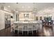 Kitchen featuring stainless steel appliances, a large island with seating, and hardwood flooring and breakfast table at 17639 Stuttgart Rd, Davidson, NC 28036