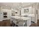 Bright and airy kitchen with stainless steel appliances, a large island, and pendant lighting at 17639 Stuttgart Rd, Davidson, NC 28036