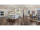 Elegant kitchen with a center island, stainless steel appliances, and breakfast table with designer chairs at 17639 Stuttgart Rd, Davidson, NC 28036