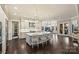 A bright kitchen featuring an oversized island with seating, and direct access to the breakfast nook at 17639 Stuttgart Rd, Davidson, NC 28036