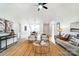 Inviting living room with vaulted ceiling, stylish furniture, and open layout to dining area, perfect for entertaining at 2146 Mallard Green Pl, Charlotte, NC 28262