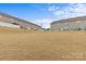 View of backyard with golden grass and neighboring houses at 2461 Palmdale Walk Dr, Fort Mill, SC 29708