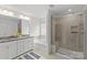 Well-appointed bathroom featuring a double sink vanity, soaking tub, and a glass-enclosed shower at 2461 Palmdale Walk Dr, Fort Mill, SC 29708