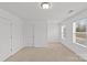 Bedroom featuring a large closet and two windows allowing for plenty of natural light at 2461 Palmdale Walk Dr, Fort Mill, SC 29708