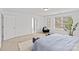 Spacious primary bedroom with neutral tones, filled with natural light, features an adjoining ensuite at 2461 Palmdale Walk Dr, Fort Mill, SC 29708